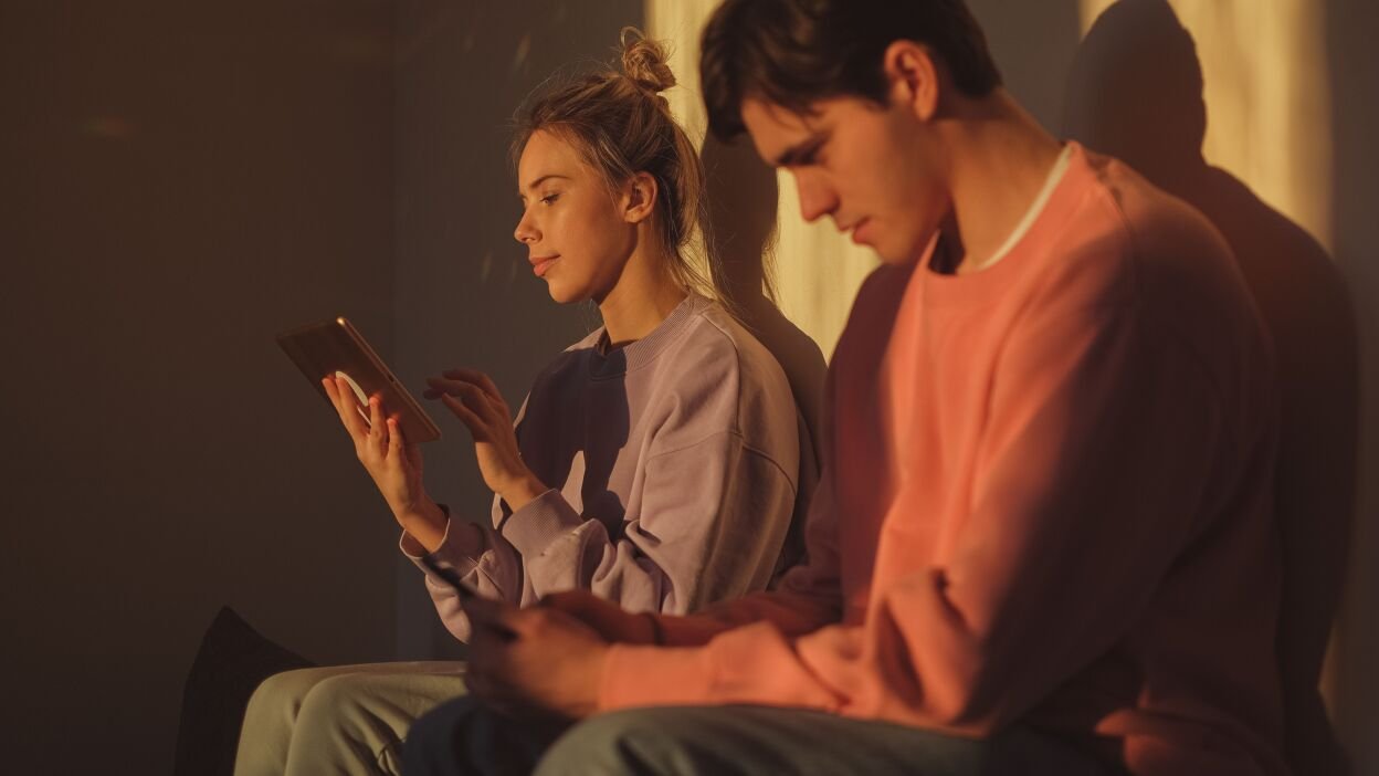 Couple looking at phones